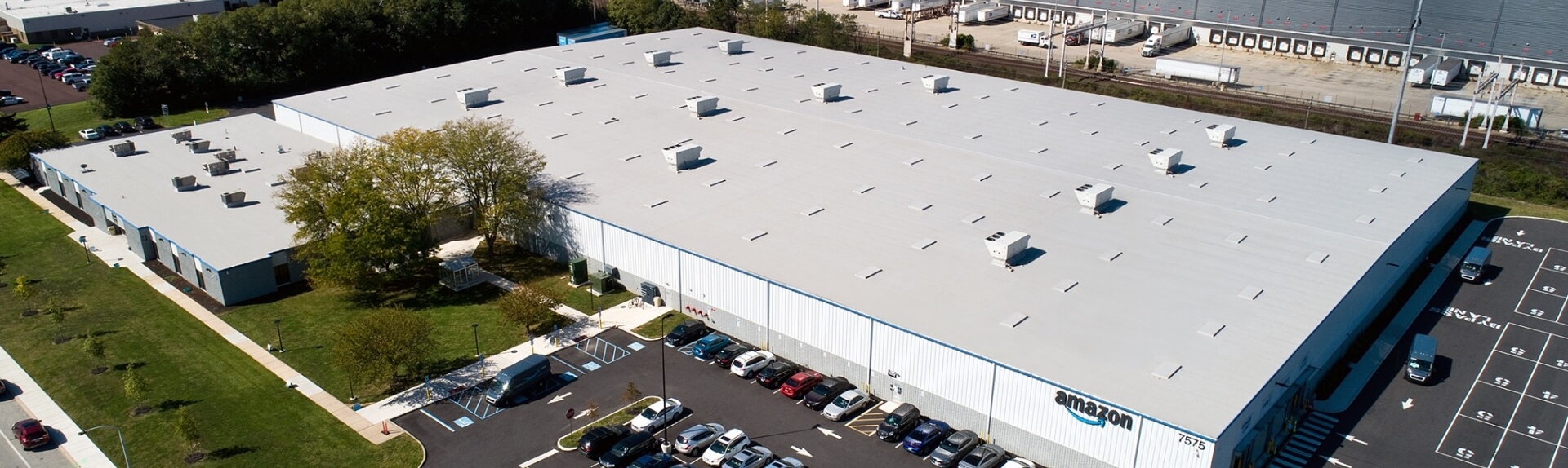 an aerial view of a large building that says amazon on it