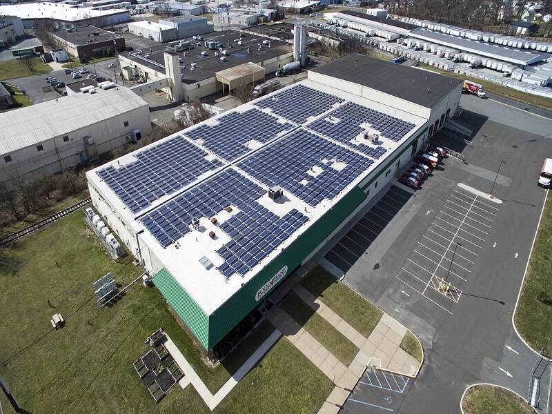 an aerial view of a food bank with solar panels on the roof
