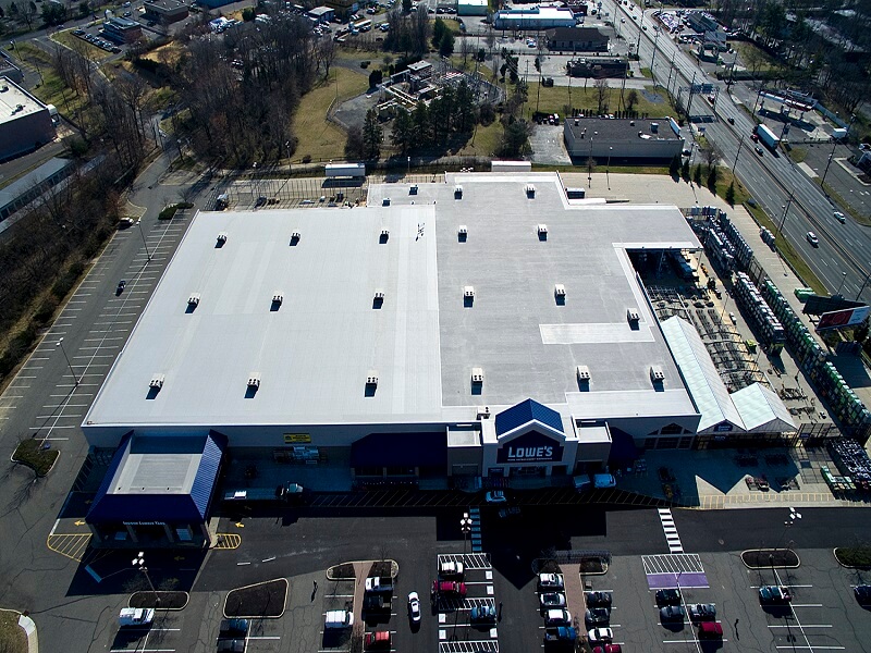 an aerial view of a lowe's store in a parking lot